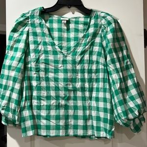Cute green and white blouse with puff sleeves.